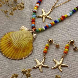 Conjunto mujer acero piedras colores conchas y estrellas