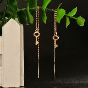 Aretes dorado mod violador llave