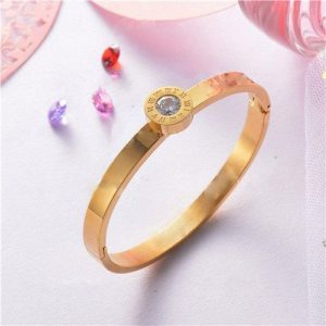 Pulsera dorado con piedra color plata