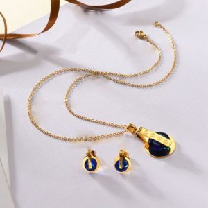 Conjunto cadena, dije y aretes dorado piedras azules