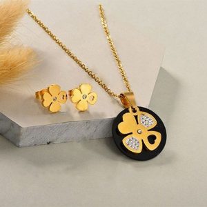 Conjunto dorado collar arete acrílico negro