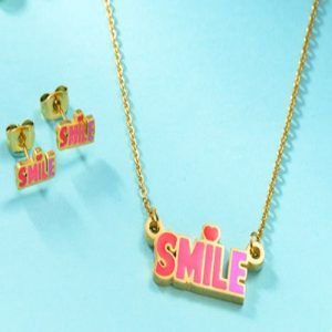 Conjunto collar  y aretes dorado mod smile