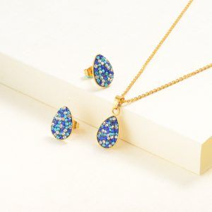 Collar y aretes dorado tipo escarcha azul