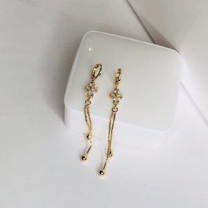 Aretes largos de cruz chapa de oro 18k
